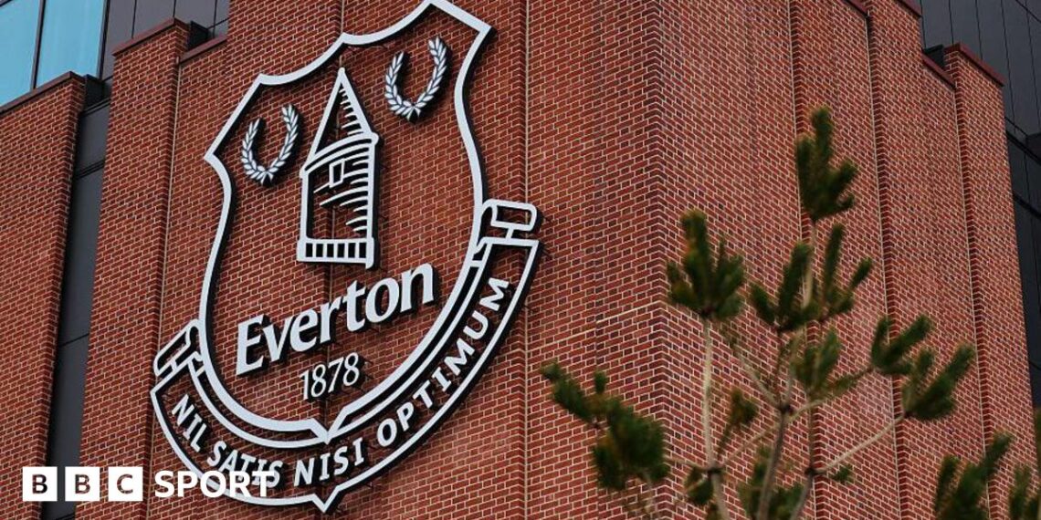 An Everton emblem seen on the exterior of the Hill Dickinson Stadium before the Premier League match between Everton and Tottenham Hotspur at Hill Dickinson Stadium