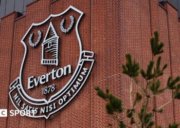 An Everton emblem seen on the exterior of the Hill Dickinson Stadium before the Premier League match between Everton and Tottenham Hotspur at Hill Dickinson Stadium