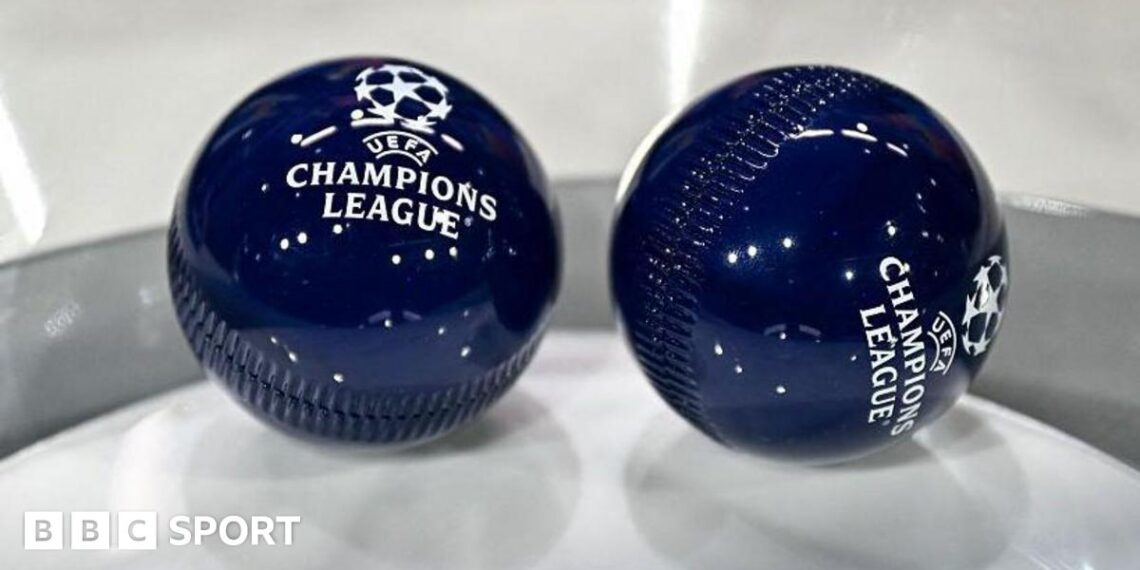 Two dark blue draw balls with the Uefa Champions League logo