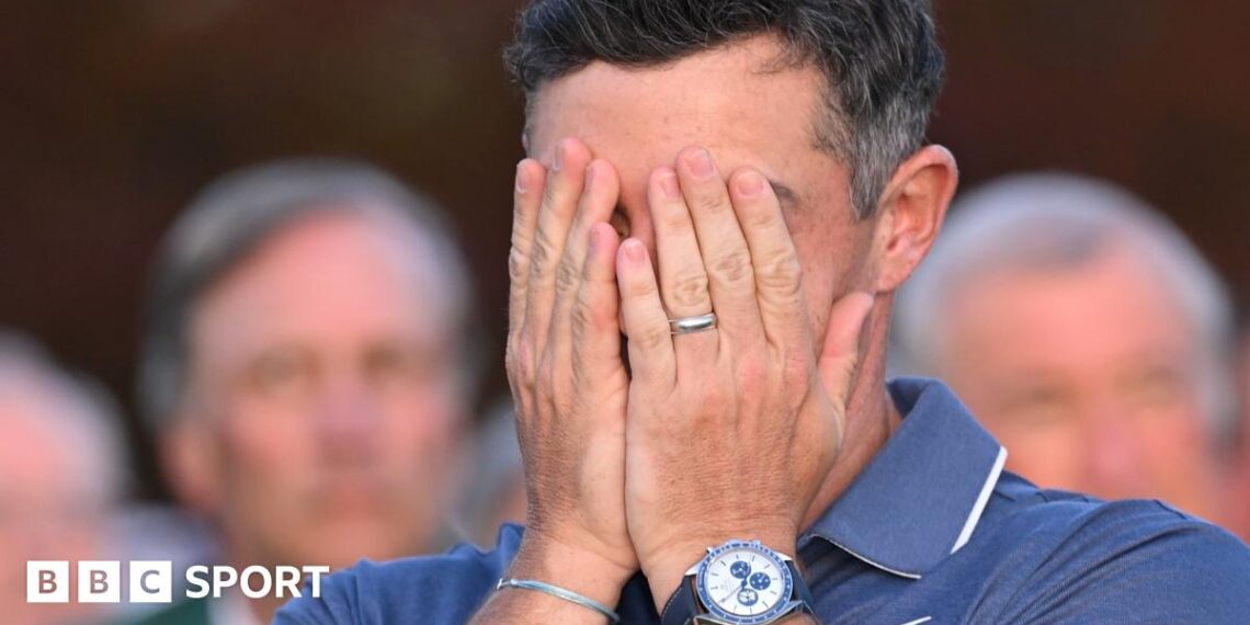 Rory McIlroy covers his face with his hands