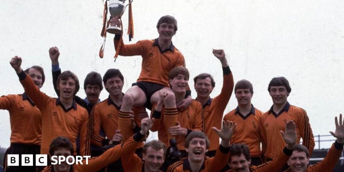 The statue of Jim McLean holding the 1983 Premier Division trophy, which was erected outside Tannadice in 2021