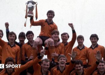 The statue of Jim McLean holding the 1983 Premier Division trophy, which was erected outside Tannadice in 2021