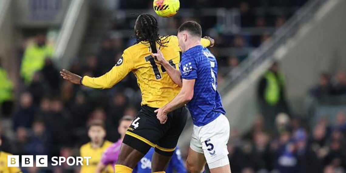 Everton's Michael Keane pulls the hair of Wolves' Tolu Arokodare