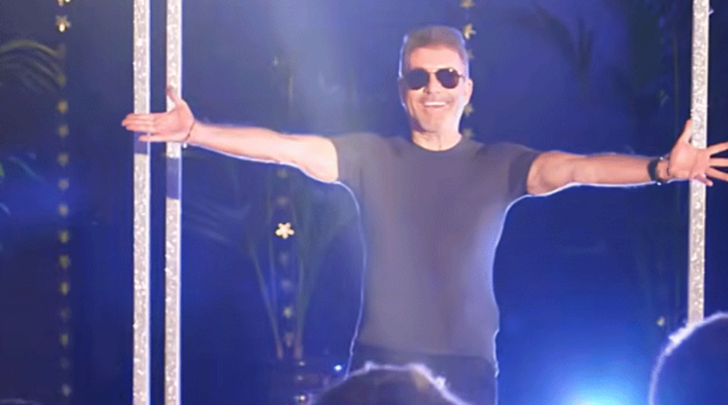Simon Cowell surprises school choir in pretend statue unveiling