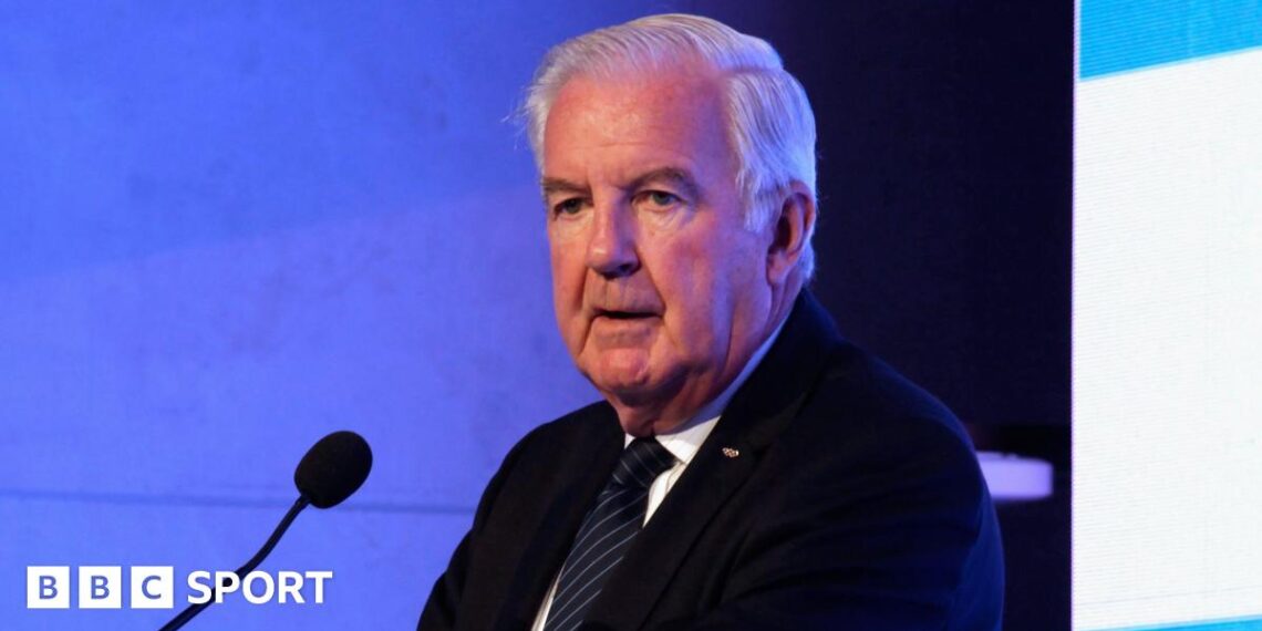 Sir Craig Reedie speaking at a podium in 2018