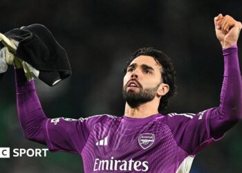 David Raya celebrates after Arsenal's 1-0 win at Sporting in the Champions League