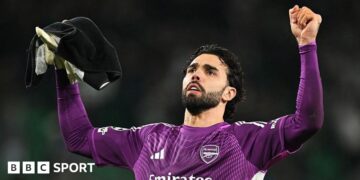 David Raya celebrates after Arsenal's 1-0 win at Sporting in the Champions League