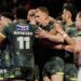 James McDonnell of Leeds celebrates with team-mates after scoring a try