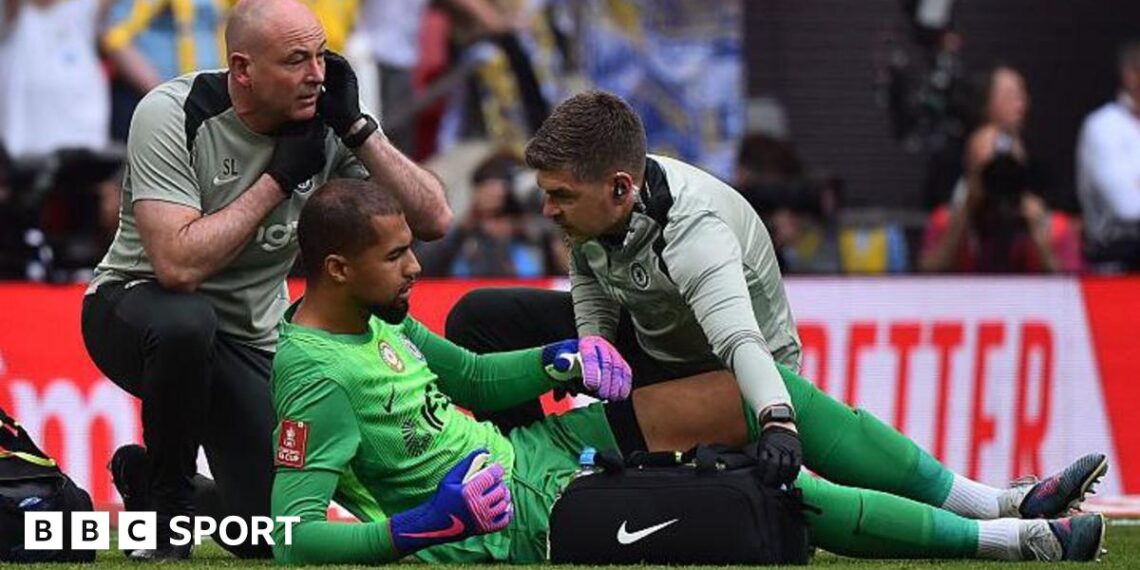 Robert Sanchez receives treatment for an apparent injury during the FA Cup semi-final between Chelsea and Leeds United at Wembley Stadium