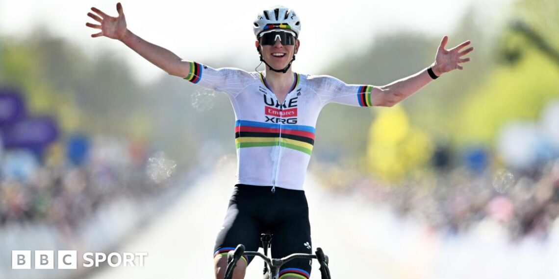 Tadej Pogacar holds his hands out wide as he celebrates winning the 2026 Tour of Flanders