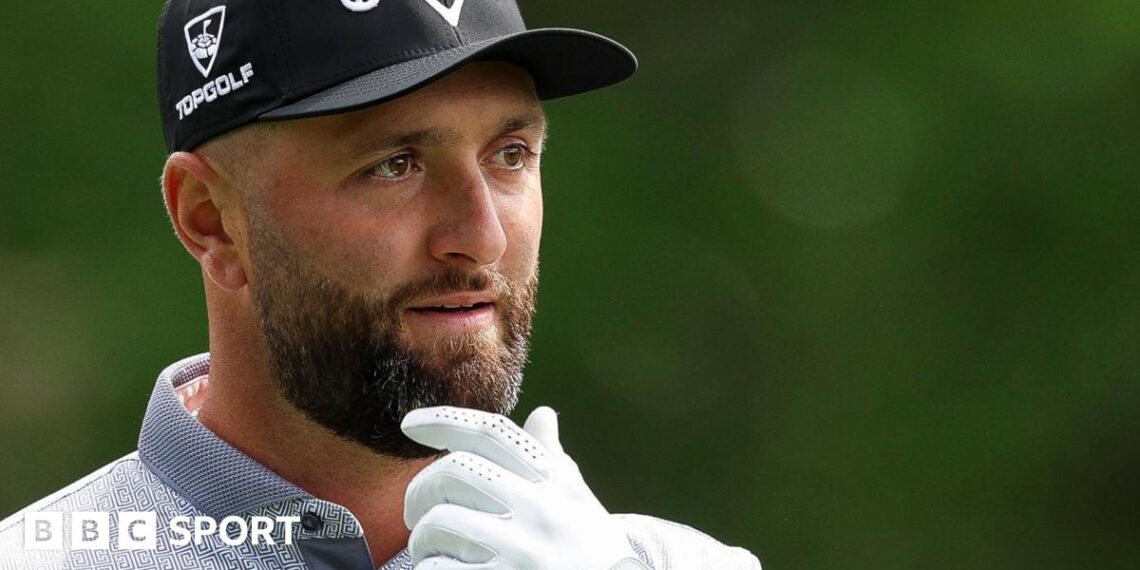 Jon Rahm with his hand on his chin