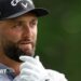 Jon Rahm with his hand on his chin