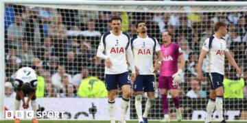 Tottenham's players react after conceding a late equaliser against Brighton