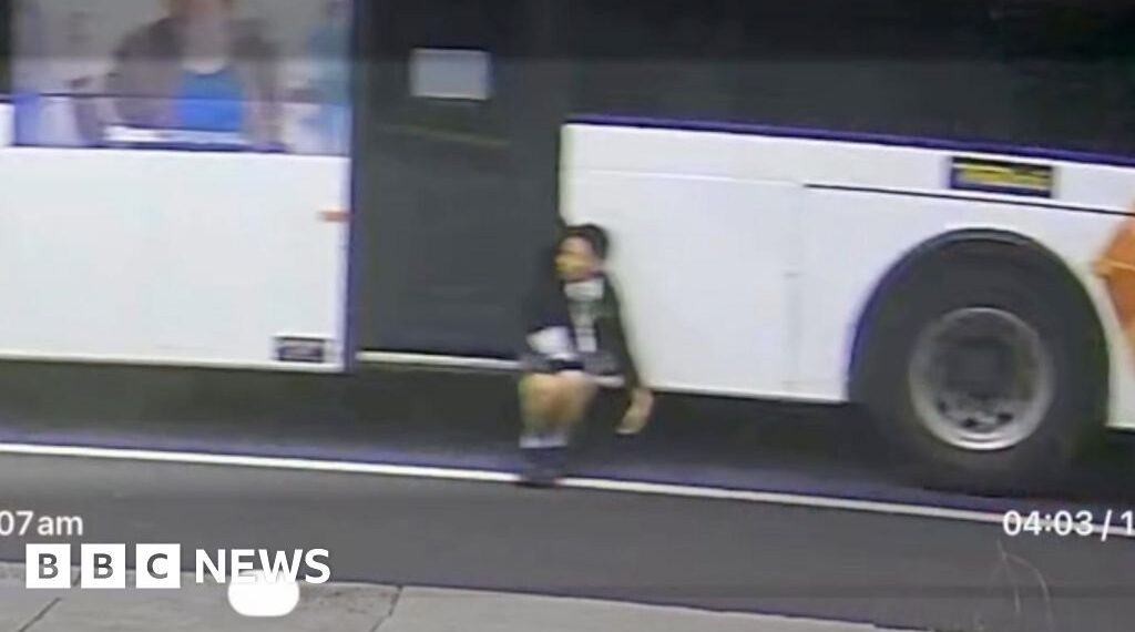Trapped boy dangles from moving bus in Australia