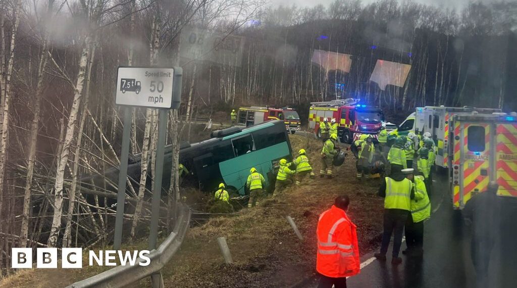 Two in hospital after bus crashes down embankment in the Highlands