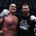 Tyson Fury and Arslanbek Makhmudov pose for photos in the ring