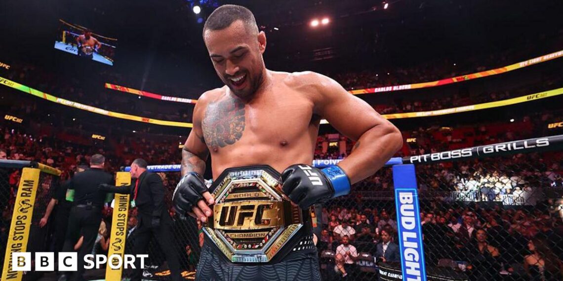 Carlos Ulberg celebrates beating Jiri Prochazka at UFC 327