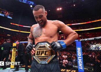 Carlos Ulberg celebrates beating Jiri Prochazka at UFC 327