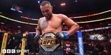 Carlos Ulberg celebrates beating Jiri Prochazka at UFC 327