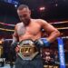 Carlos Ulberg celebrates beating Jiri Prochazka at UFC 327