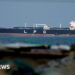 UK says Iran holding world economy 'hostage' with Hormuz attacks