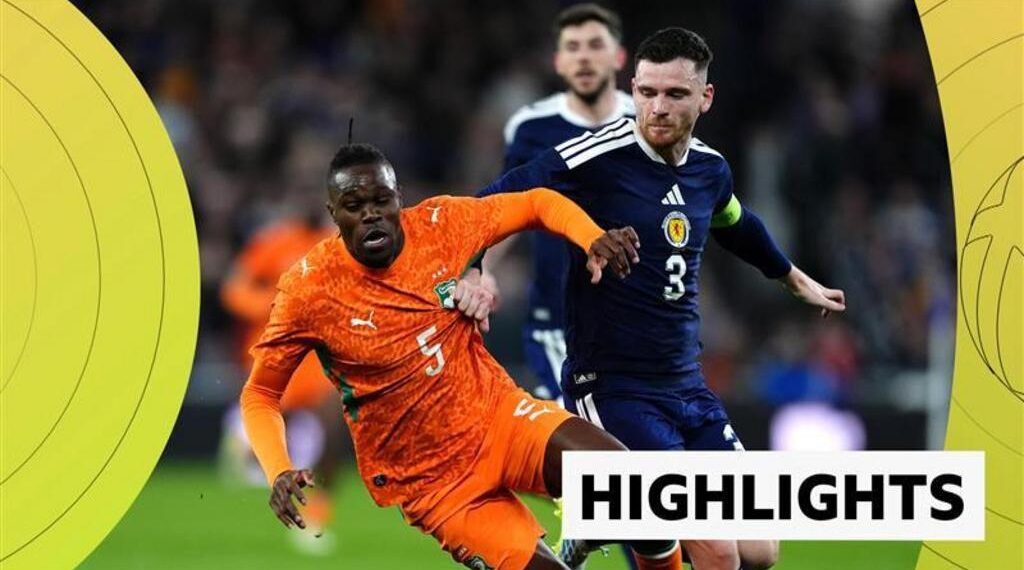 Andy Robertson battles with Wilfried Singo