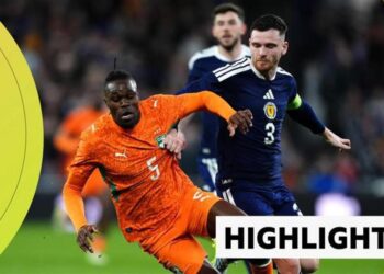 Andy Robertson battles with Wilfried Singo