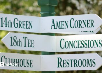 A sign at Augusta National Golf Club showing directions to Amen Corner, the 18th tee, concessions, the clubhouse and restrooms
