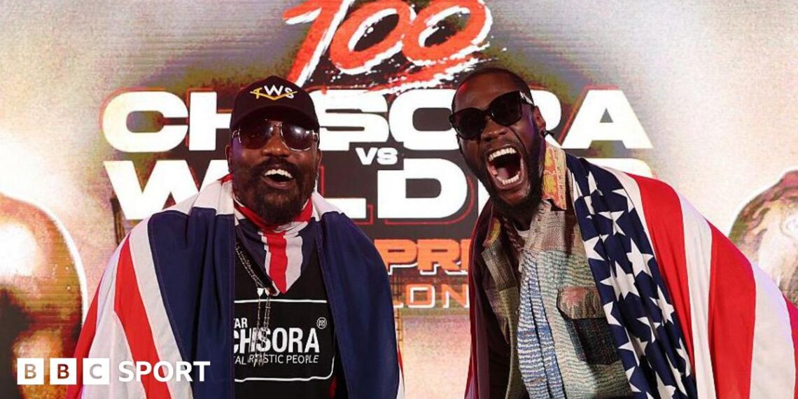 Deontay Wilder and Derek Chisora pose for cameras at a news conference