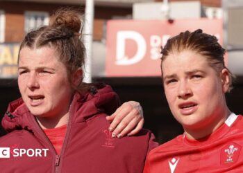 Kate Williams and Bethan Lewis in a team huddle