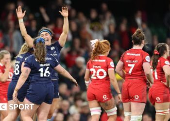 Scotland players celebrate victory over Wales in Cardiff