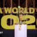 The World Cup on display on a white stand prior to the draw in December in Washington with Fifa World Cup 2026 in big gold letters in the background.