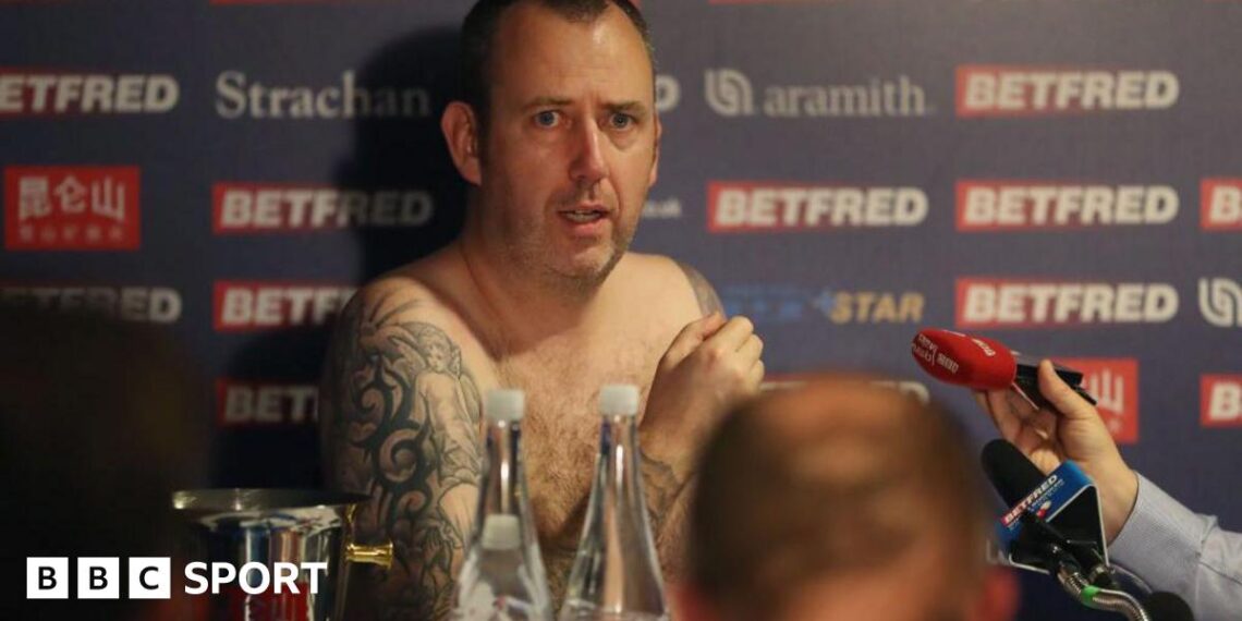 Mark Williams naked surrounded by microphones after winning his third world title in 2018