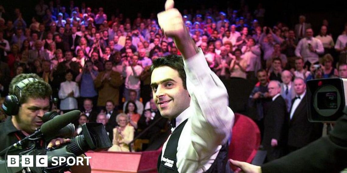 Ronnie O'Sullivan smiles and celebrates with a thumbs-up gesture after winning the 2001 World Championship