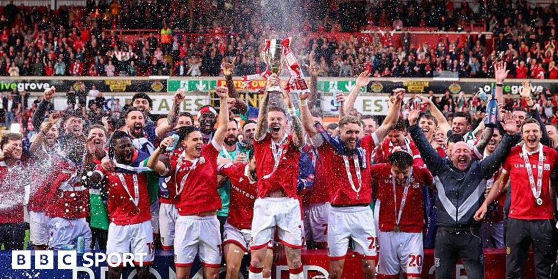 Wrexham's players celebrate promotion to the Championship in 2025