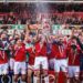 Wrexham's players celebrate promotion to the Championship in 2025
