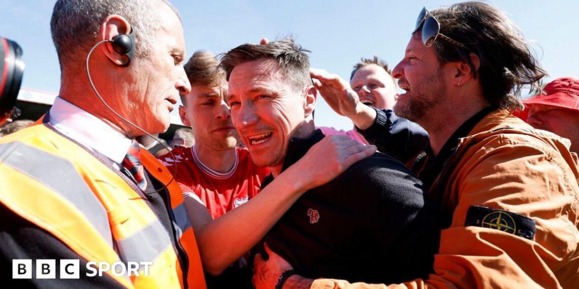 York boss Stuart Maynard is mobbed by supporters at full-time