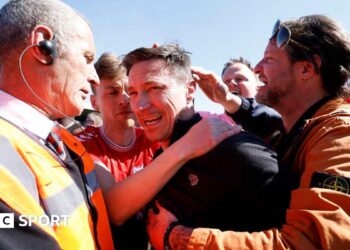 York boss Stuart Maynard is mobbed by supporters at full-time