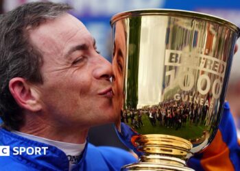Wayne Lordan kisses the 1,000 Guineas trophy