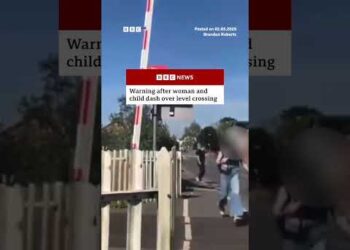 Warning issued after woman and child dash over level crossing. #England #BBCNews