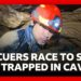 Rescuers race to free five people trapped in flooded cave in Laos | BBC News