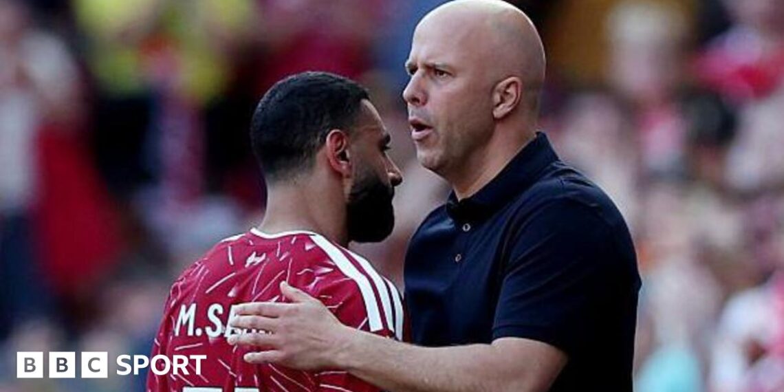 Arne Slot gives Mohamed Salah a pat on the back