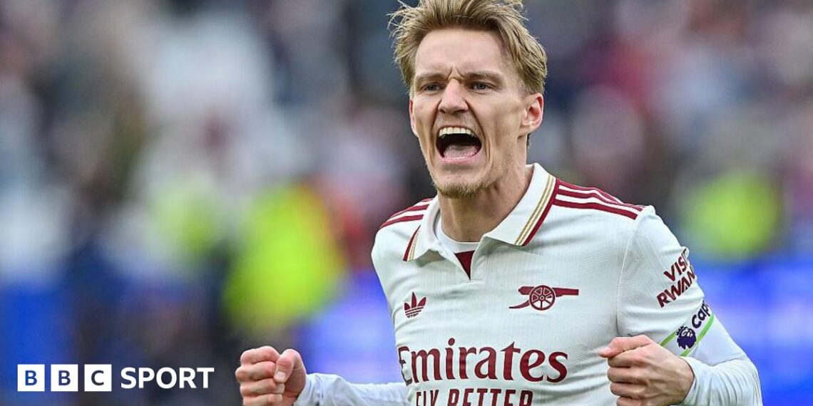 Martin Odegaard celebrates Arsenal's win.
