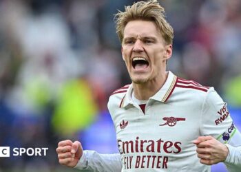 Martin Odegaard celebrates Arsenal's win.