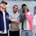 Arsenal players pose with a cutout of the Premier League trophy
