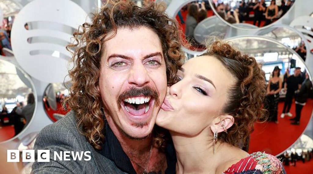 Australian musician's US ban prompts apology from girlfriend over Trump post