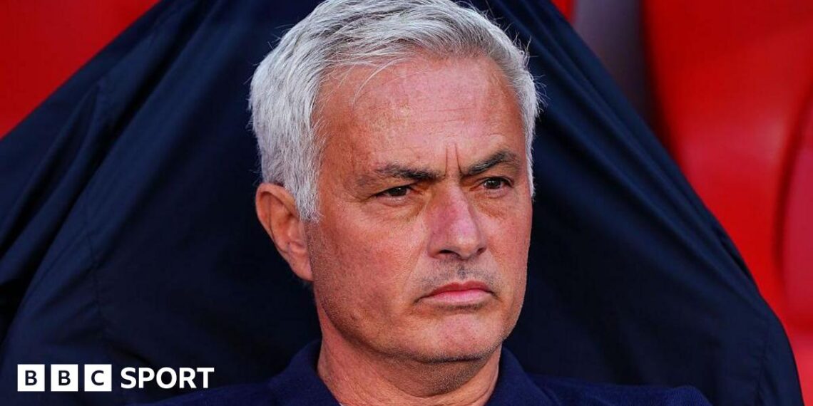 Jose Mourinho looks on in the Benfica dugout