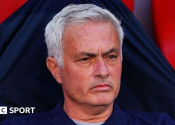 Jose Mourinho looks on in the Benfica dugout