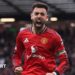Referee Michael Salisbury signals before he awards a second goal to Matheus Cunha of Manchester United after a VAR check