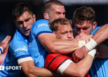 Mike Haley is tackled by the Bulls